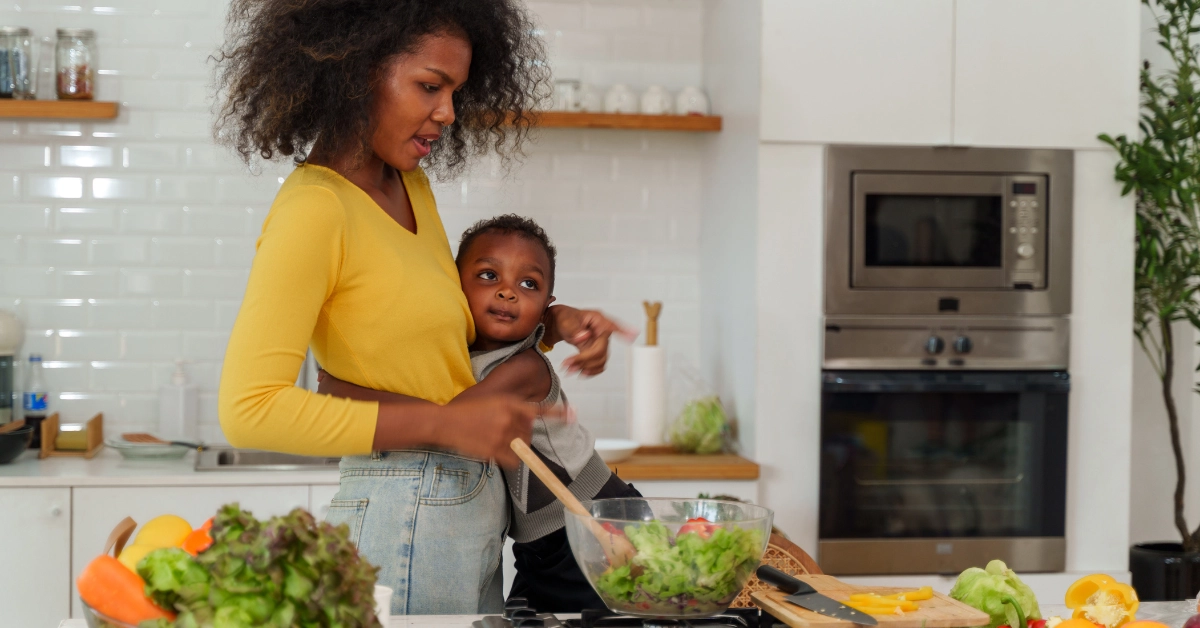 Mom cooking in kitchen with preschooler. Easy quick weeknight dinners for preschoolers that are nutritious, kid-approved, and ready in 30 minutes or less to make life stress-free.