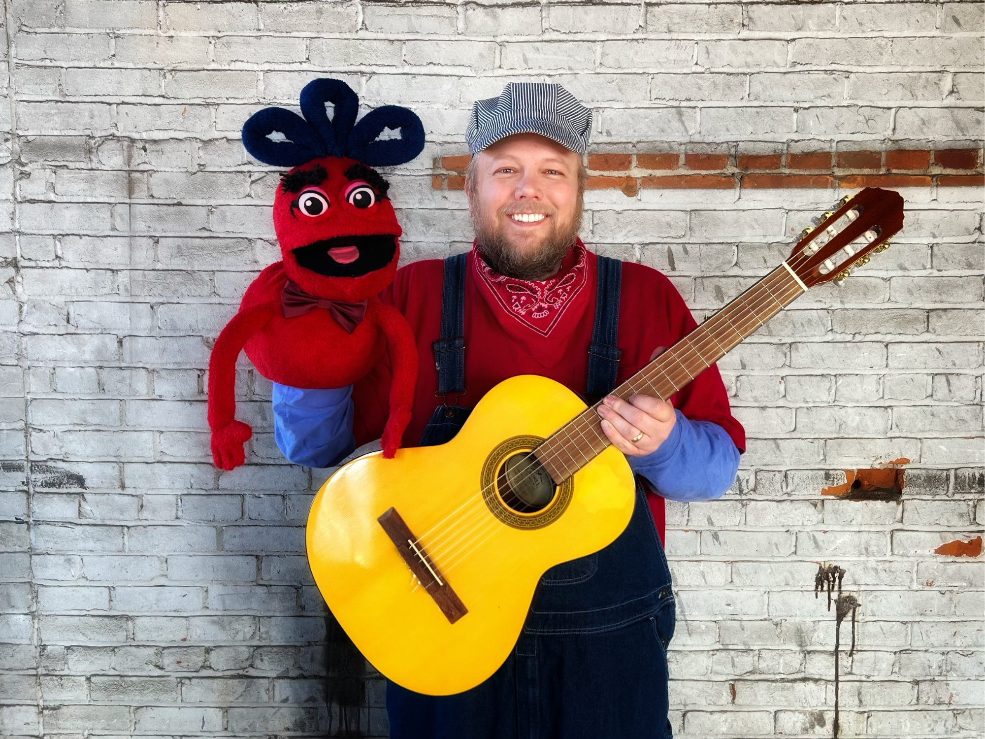 Children's musician and educator Conductor Jack with his puppet friend Naybob