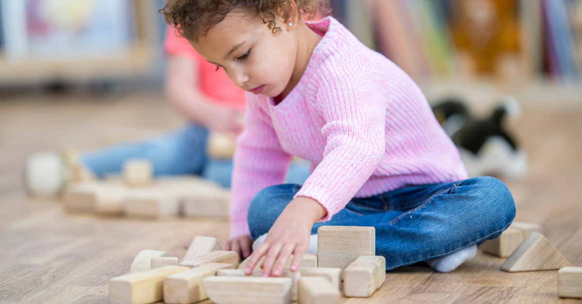 Preschooler playing with blocks